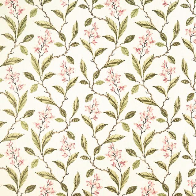 Ivory floral textile with pink blossom sprigs and apple-green leafy branches