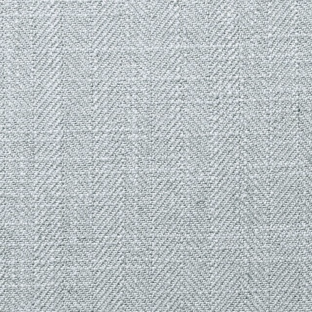 Pale blue-grey Henley fabric showing a finely mottled woven chambray texture