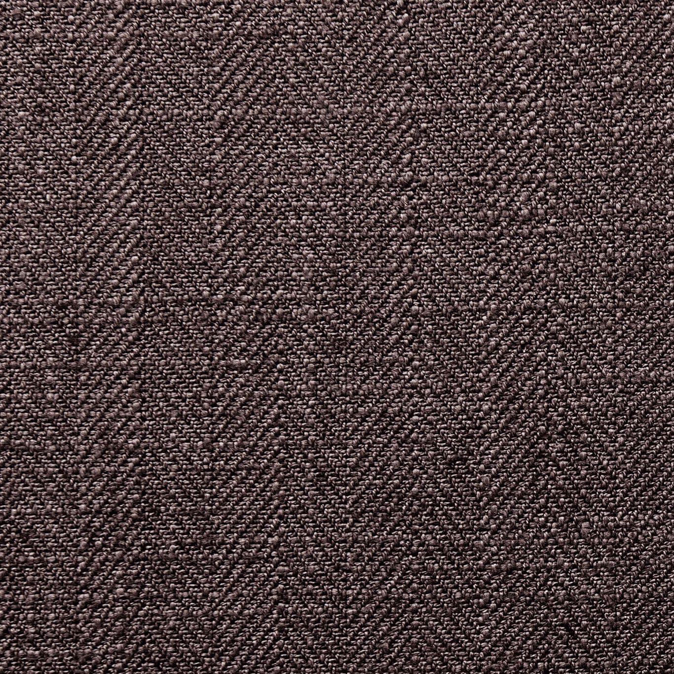 Close-up of deep warm charcoal fabric with dense nubby tonal woven texture
