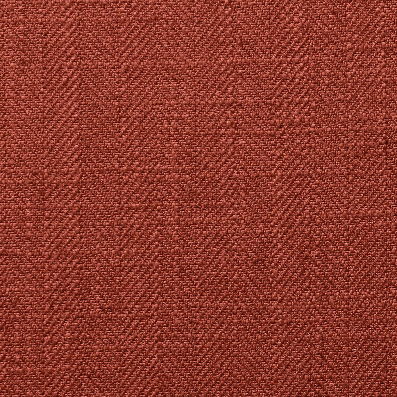 Close-up of deep cinnabar red fabric with dense, irregular woven texture