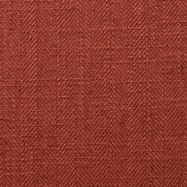 Close-up of deep cinnabar red fabric with dense, irregular woven texture