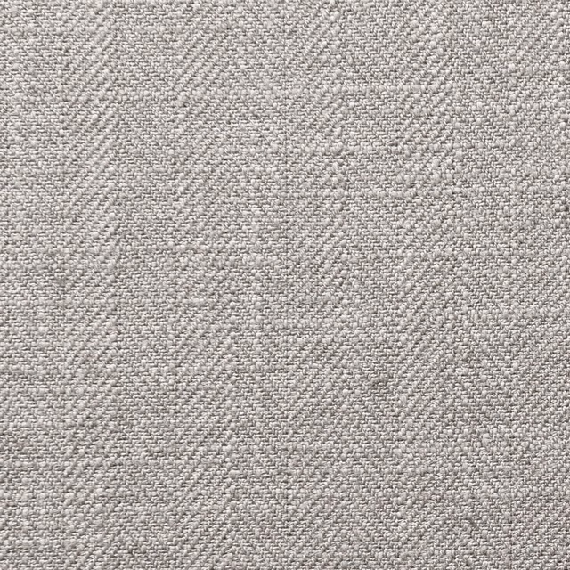 Close-up of softly mottled silver-grey woven upholstery fabric with fine textured flecks