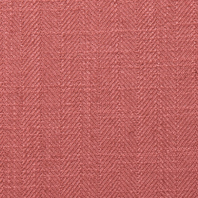Close-up of dusty garnet red fabric with a fine irregular woven texture
