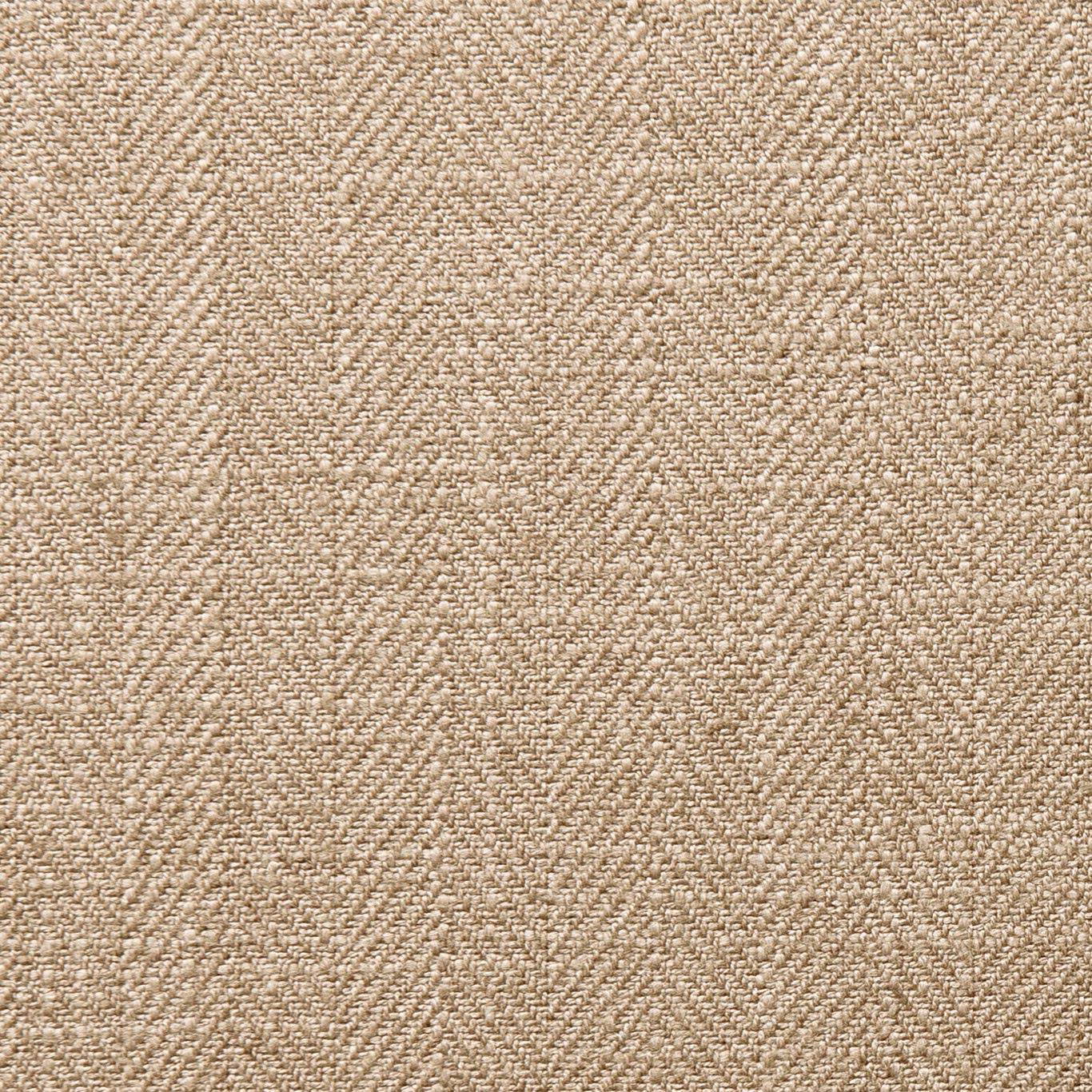Close-up of warm latte beige fabric with a dense, softly mottled woven texture