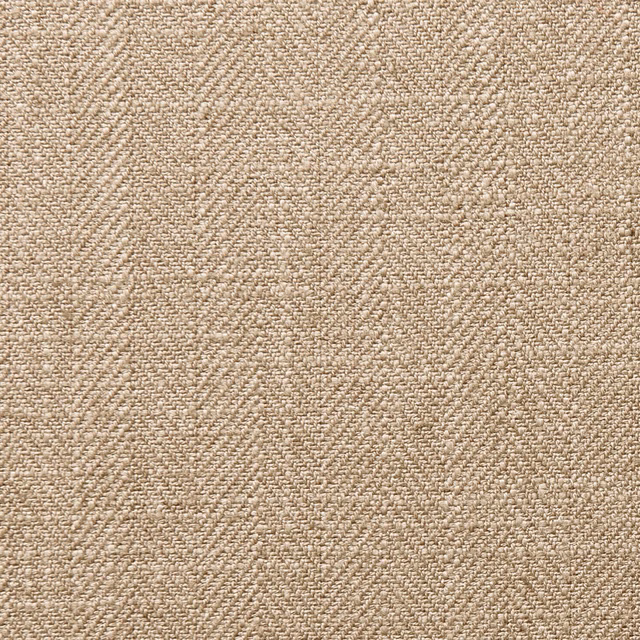 Close-up of warm latte beige fabric with a dense, softly mottled woven texture