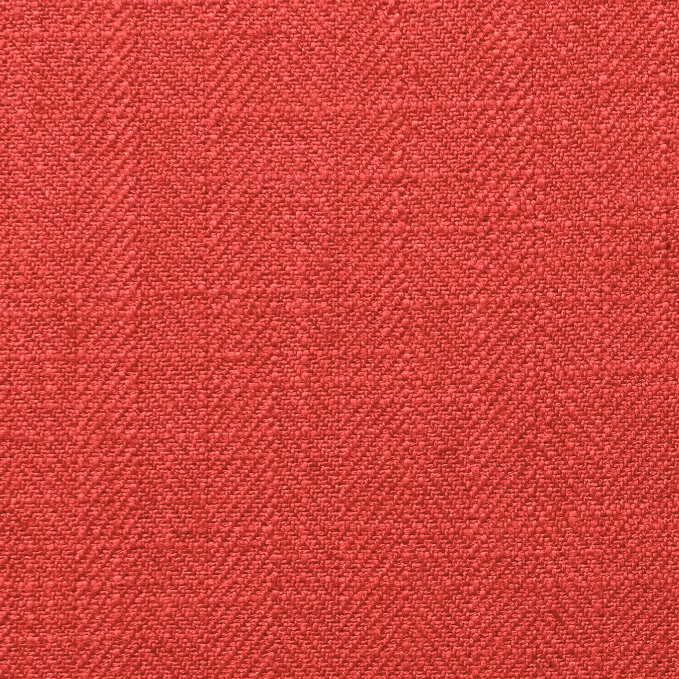 Close-up of saturated lipstick-red fabric with dense, subtly flecked woven texture