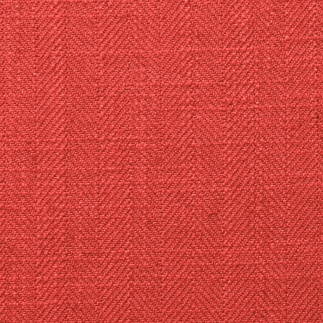 Close-up of saturated lipstick-red fabric with dense, subtly flecked woven texture