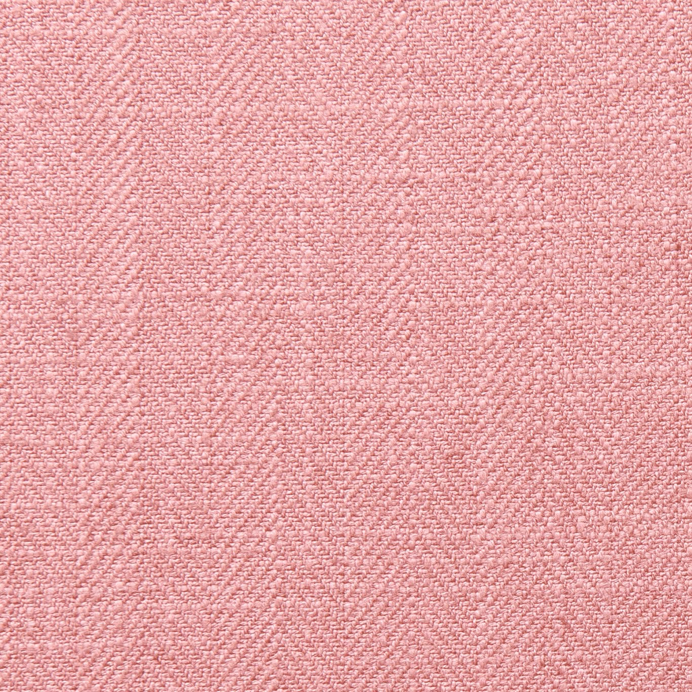 Close-up of dusty blush-pink fabric with a fine, softly mottled woven texture