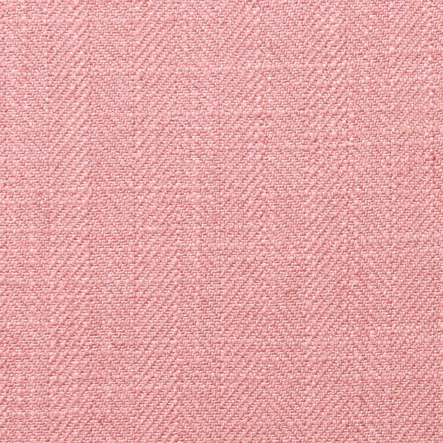 Close-up of dusty blush-pink fabric with a fine, softly mottled woven texture