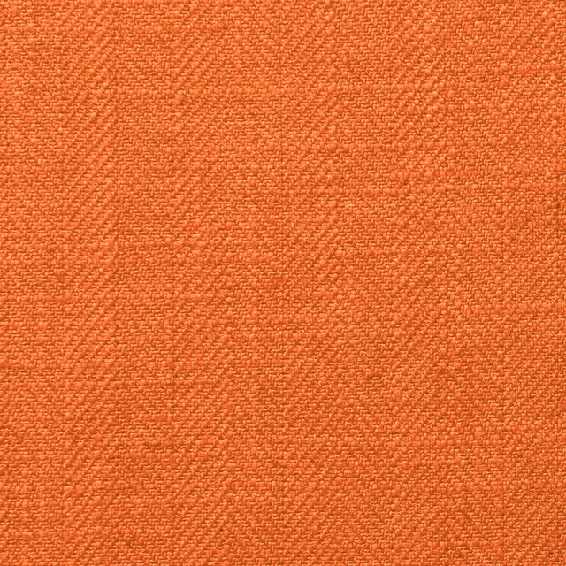 Close-up of warm burnt-orange Henley fabric with a dense, nubby woven texture