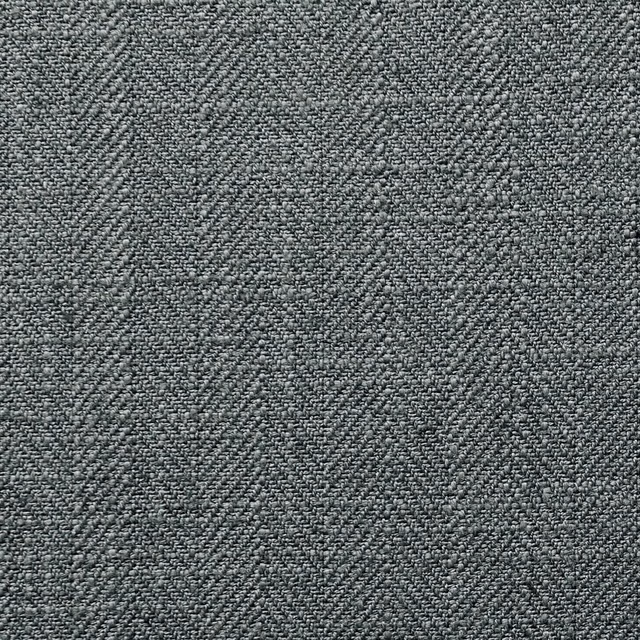 Close-up of cool steel-grey fabric with a dense, finely pebbled woven texture