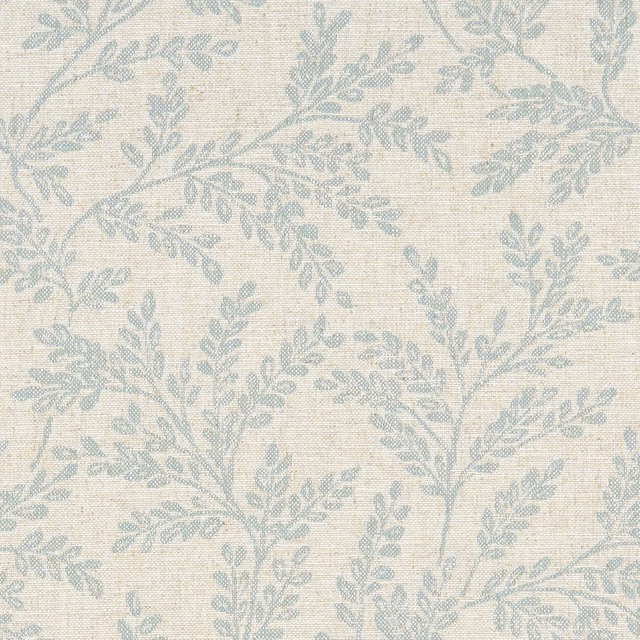 Pale duckegg blue leafy branches woven across a textured cream fabric ground