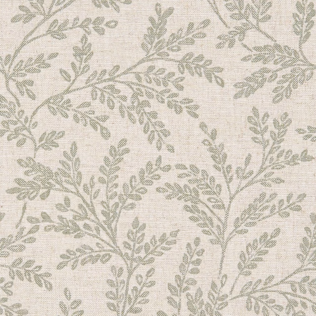 Muted sage leafy branches woven across a pale cream textured fabric ground