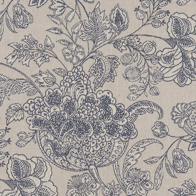 Denim-blue botanical flowers and paisley leaves woven across a taupe ground