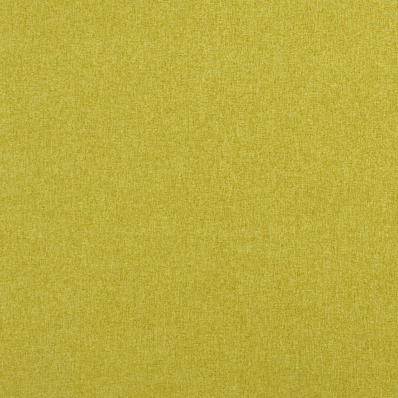 Close-up of warm chartreuse green fabric with a fine, softly mottled woven texture