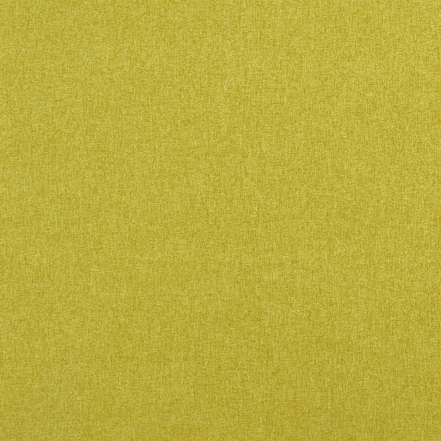 Close-up of warm chartreuse green fabric with a fine, softly mottled woven texture