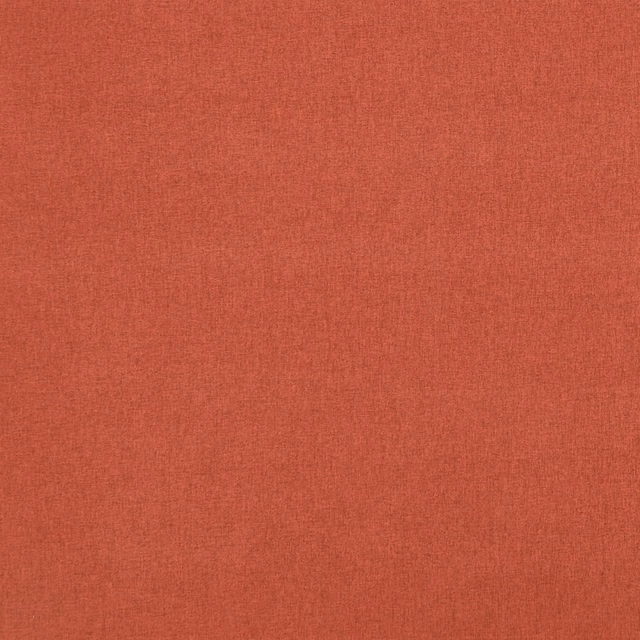 Paprika-red textile with a fine, subtly mottled woven surface