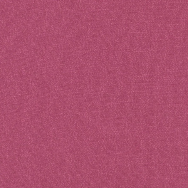 Close-up of richly saturated raspberry pink plain woven fabric with subtle fine texture
