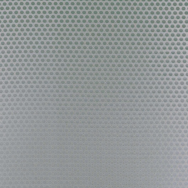 Cool mineral grey-green fabric showing a small, tightly woven oval lattice