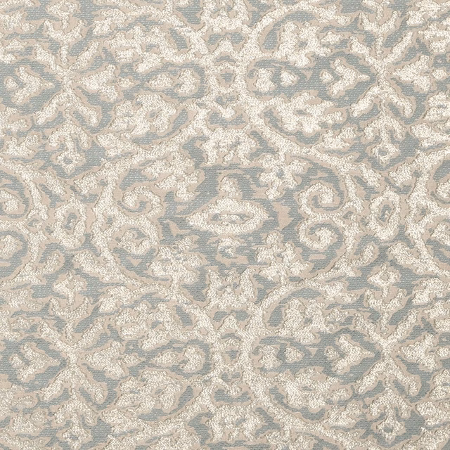 Mineral blue-grey woven fabric with ivory scrolling floral and paisley motifs