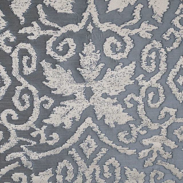Ivory scrolling damask on a dusty blue-grey textured fabric ground