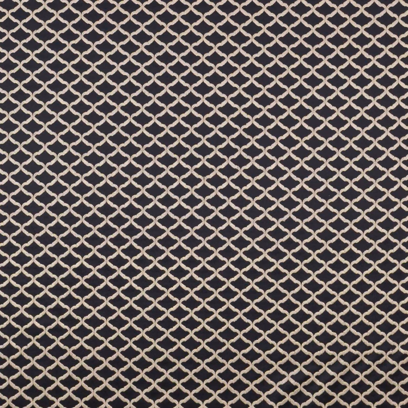 Ebony-black woven ground with a small ivory interlocking lattice and softly textured surface