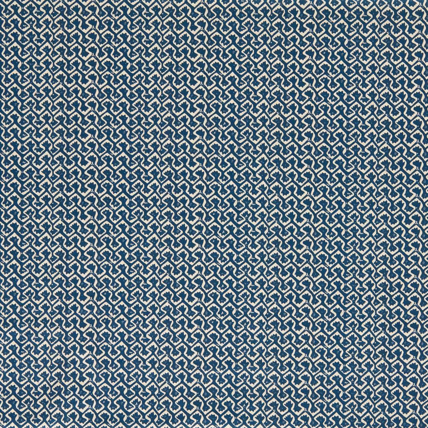Ink-blue woven ground with dense cream interlocking geometric motifs