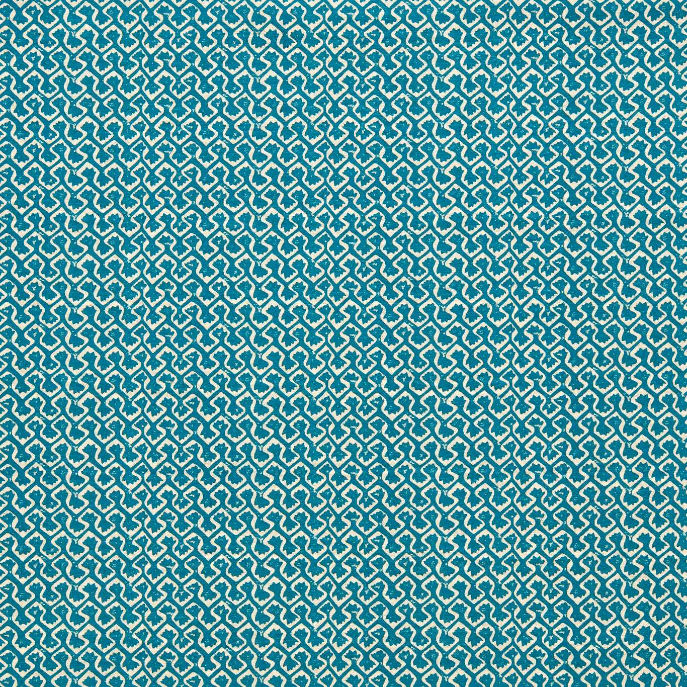 Saturated teal fabric with a dense cream interlocking geometric weave