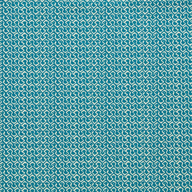 Saturated teal fabric with a dense cream interlocking geometric weave