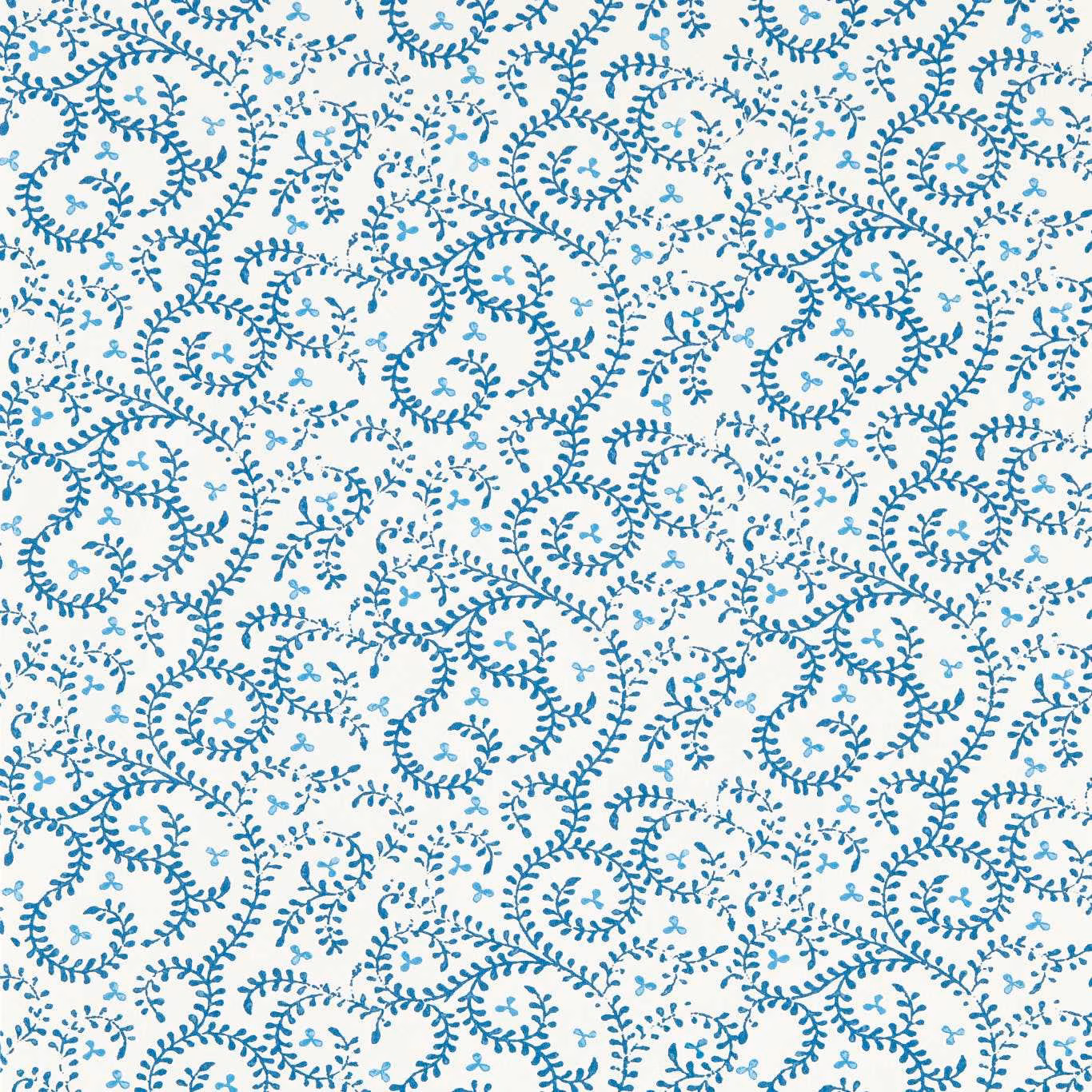 Cream wallpaper with dense cool blue curling vines and leafy spiral motifs