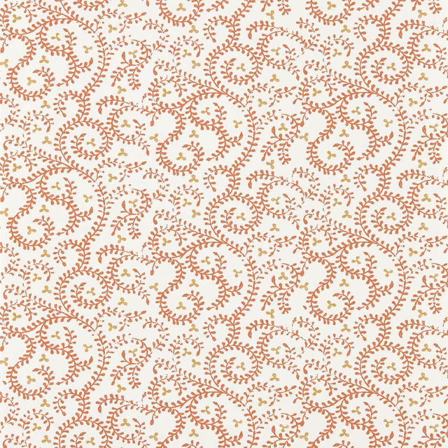 Warm cream wallpaper with dense terracotta paisley scrolls and tiny sage accents