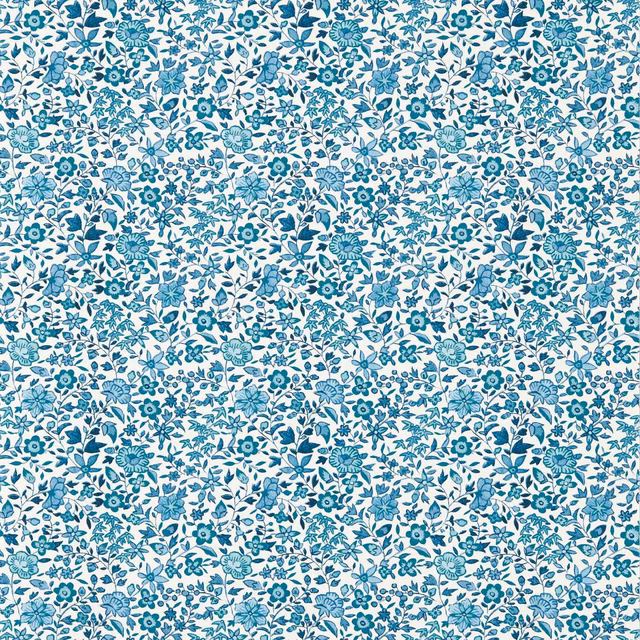 Dense cobalt and teal floral sprigs scattered across a pale wallpaper ground