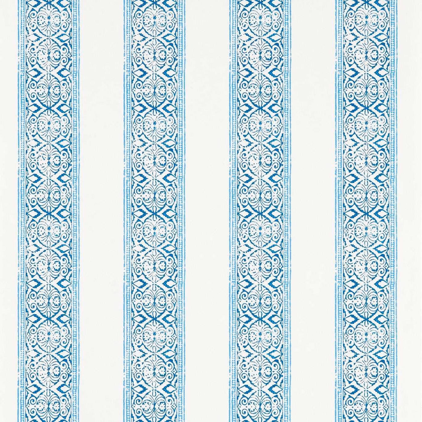 Cobalt blue scrolling floral wallpaper bands on an icy white ground