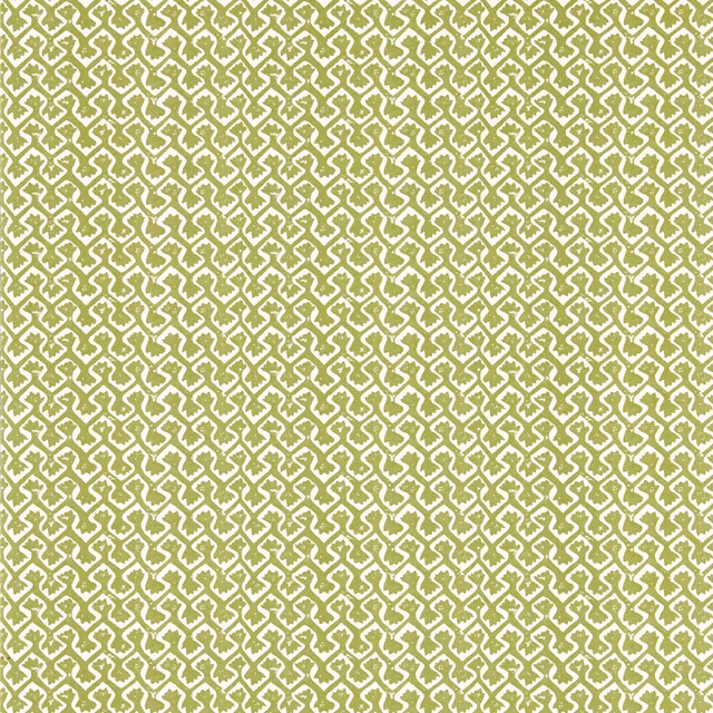 Dense apple-green geometric wallpaper on a warm cream ground, shown close-up