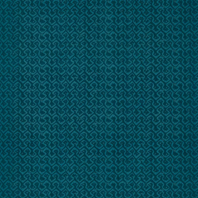 Deep teal wallpaper with small dark geometric motifs and a subtly mottled surface