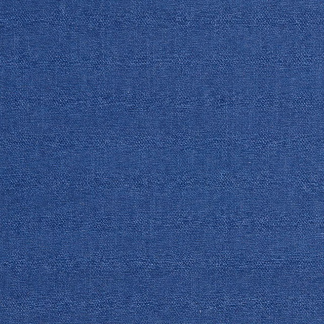 Close-up of saturated cobalt-blue chenille with a fine, softly variegated woven texture