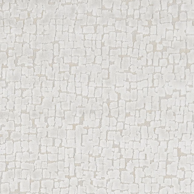 Pale ivory woven textile with softly outlined, irregular brick-like blocks