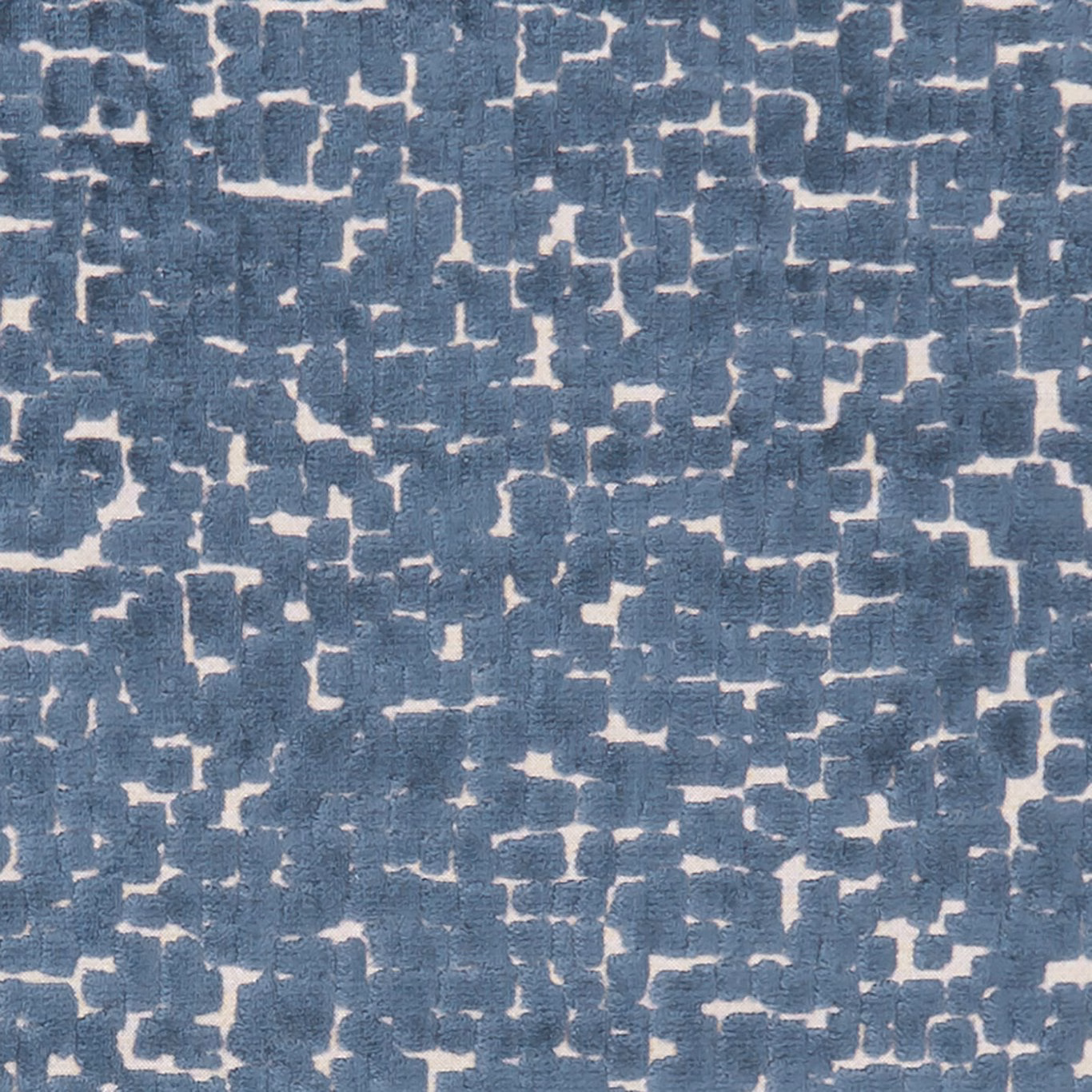 Textured muted navy fabric with irregular ivory geometric breaks and woven striations