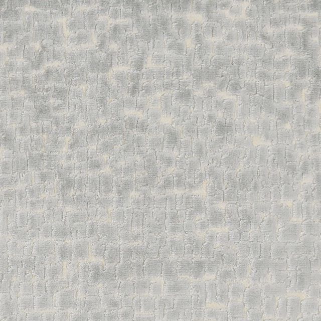 Pale slate-grey woven textile with chalky blocks and distressed vertical texture