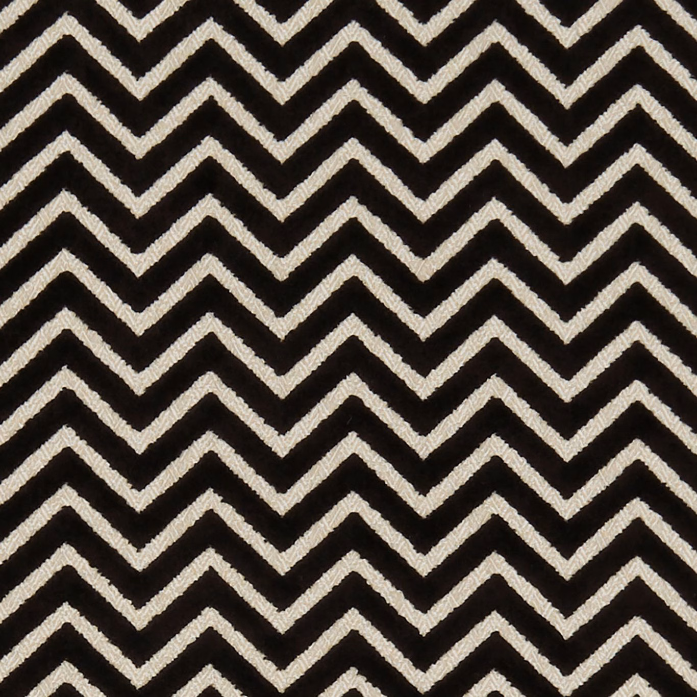 Black woven fabric with tightly spaced ivory chevron stripes and textured surface