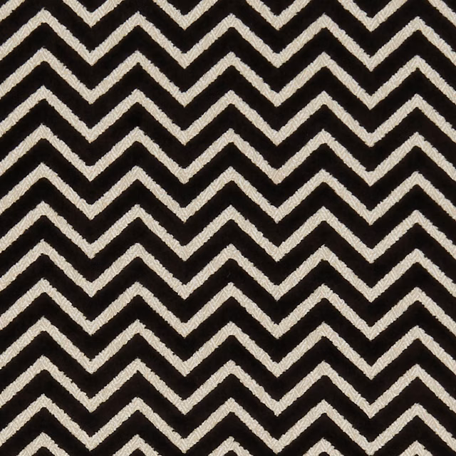 Black woven fabric with tightly spaced ivory chevron stripes and textured surface