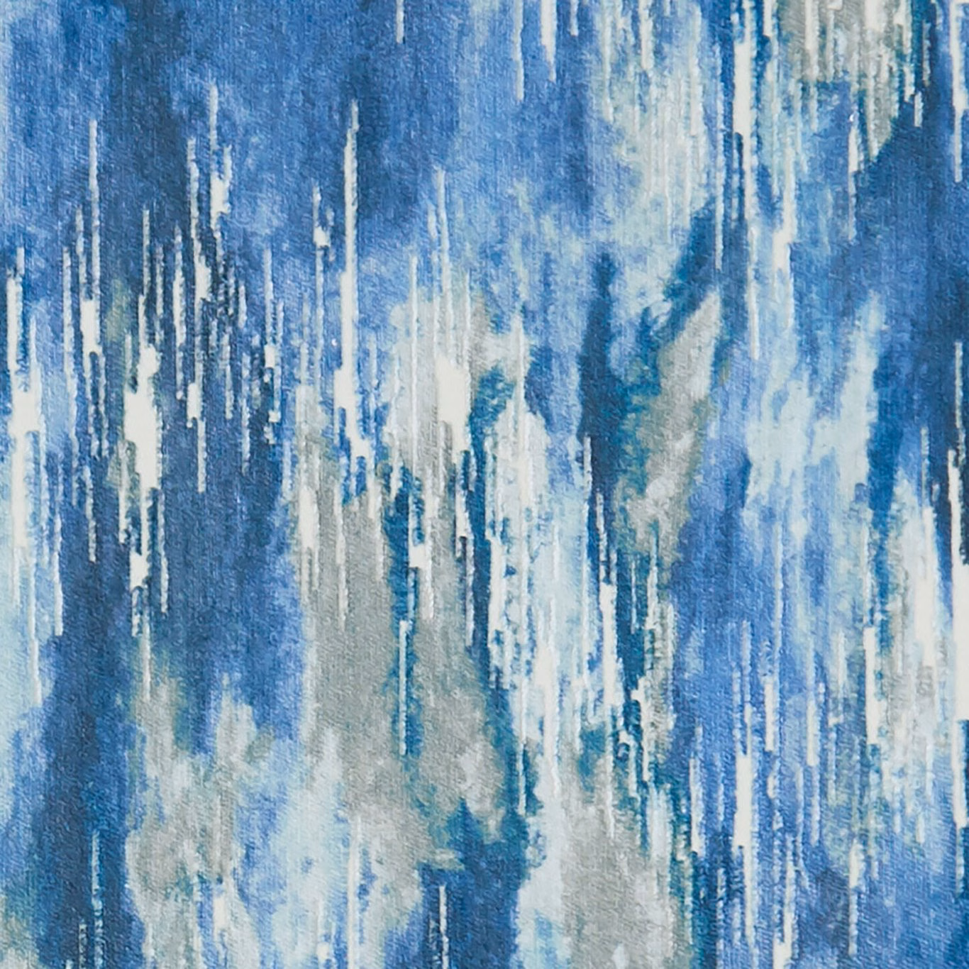 Cool denim-blue abstract woven fabric with icy streaks, pale grey and cream