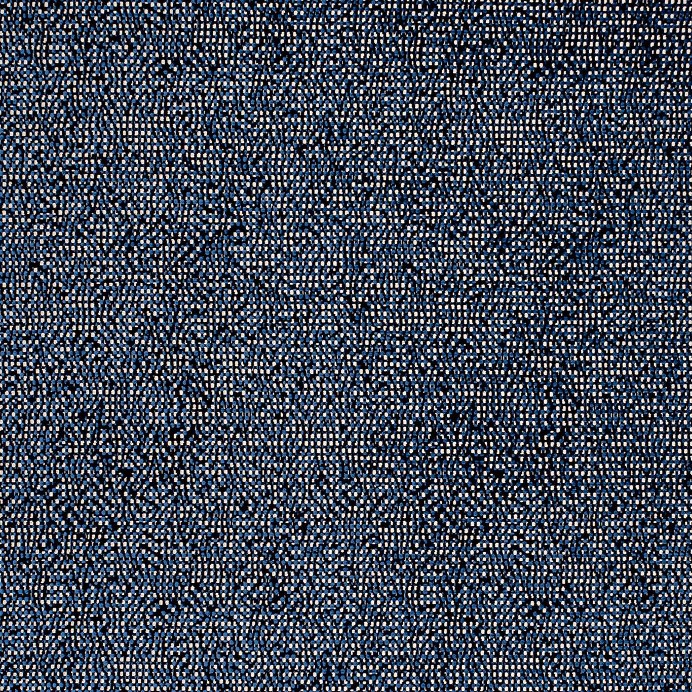 Close-up of deep indigo woven fabric with pale blue flecks and mottled texture