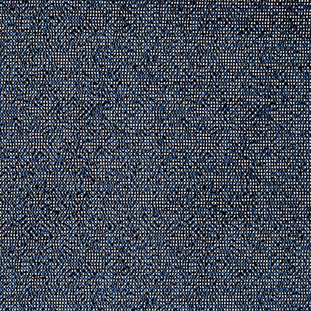 Close-up of deep indigo woven fabric with pale blue flecks and mottled texture