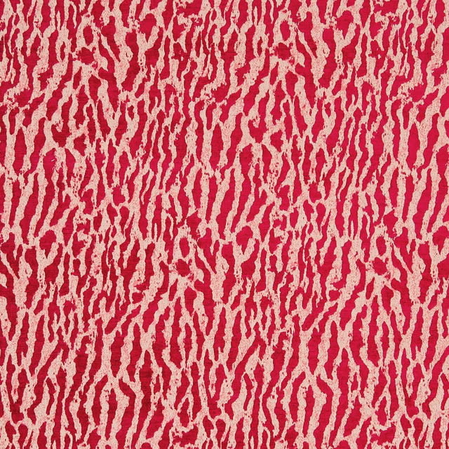 Close-up of crimson fabric with irregular ivory vertical striations and textured surface