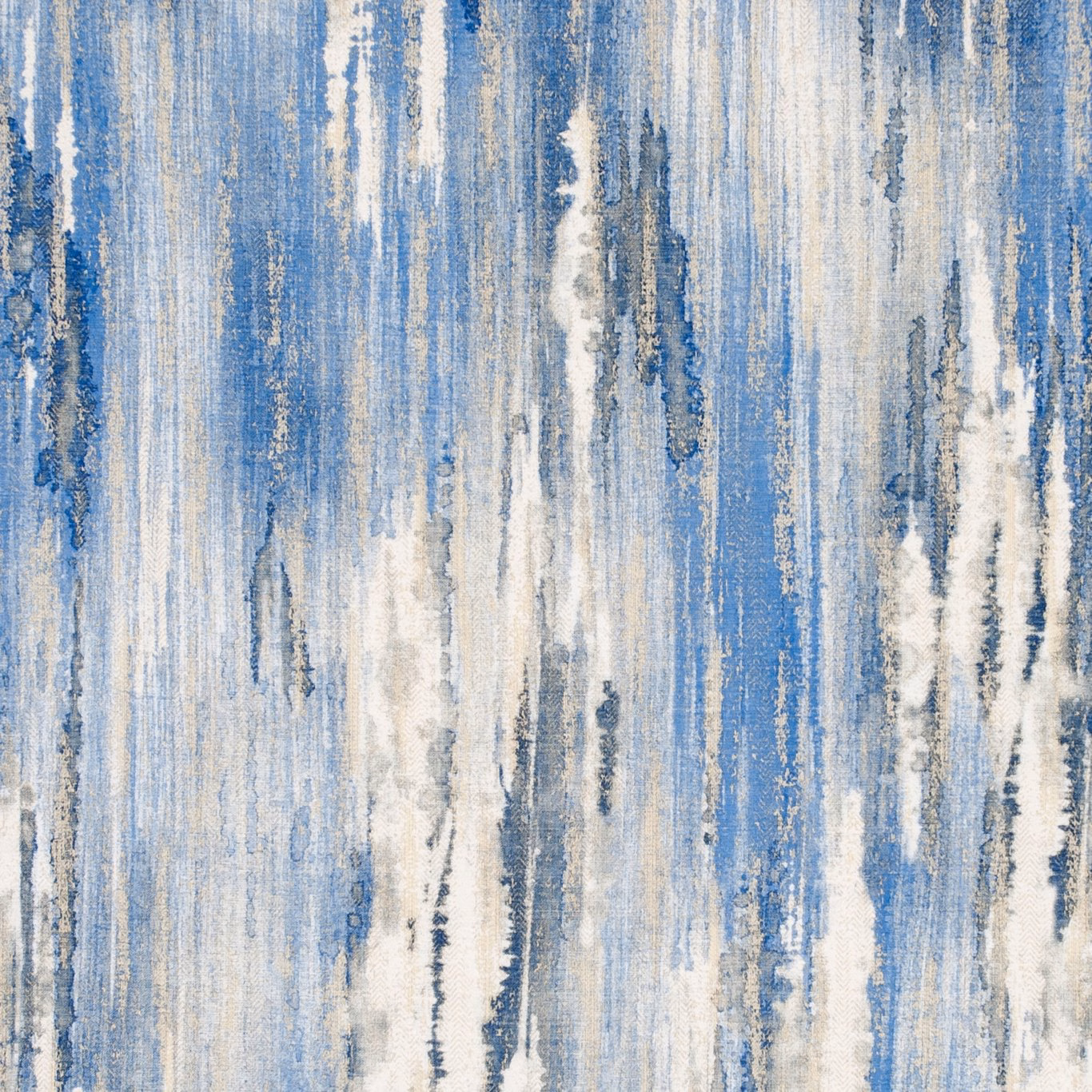 Indigo blue fabric with ivory and charcoal vertical painterly streaks and textured highlights