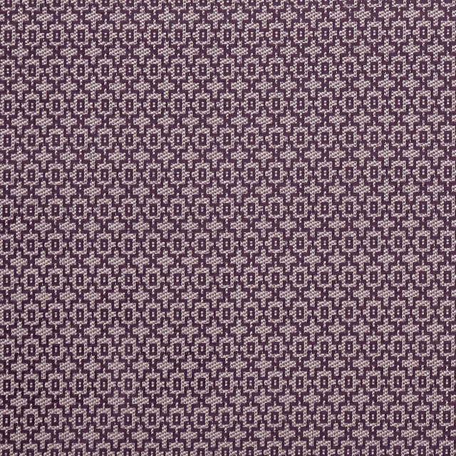 Deep damson plum woven fabric with tiny cream geometric diamond motifs and textured surface
