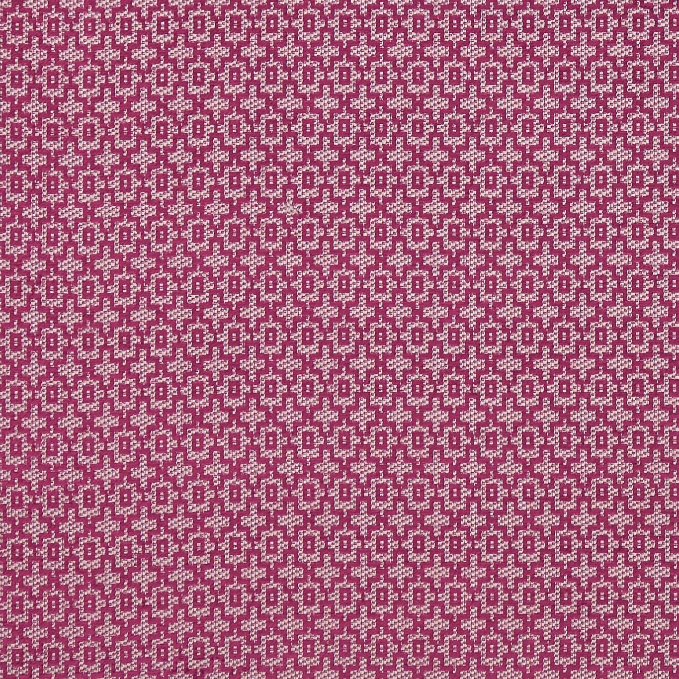 Rich raspberry-plum textile with tiny cream stepped geometric motifs