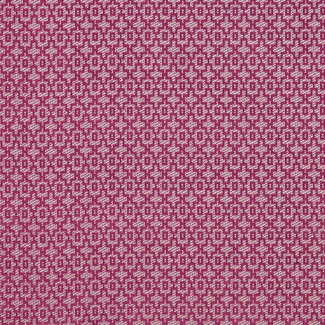 Rich raspberry-plum textile with tiny cream stepped geometric motifs