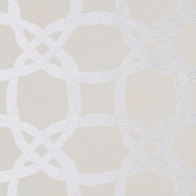Pale champagne textile with white interlocking geometric bands and fine woven texture